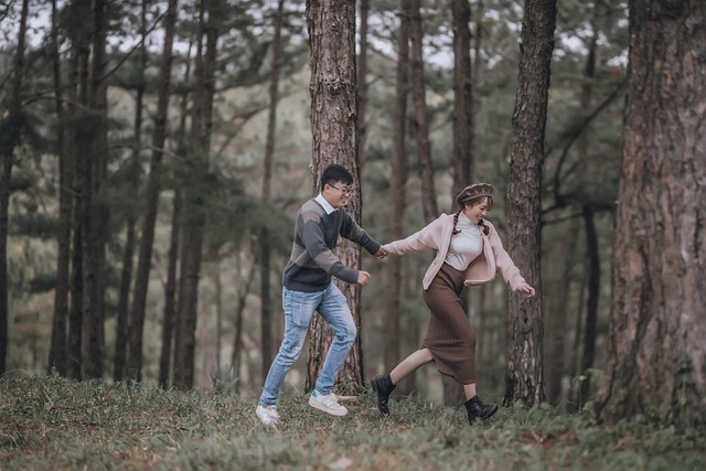 Stylish camel wool overcoat worn by woman walking in autumn park