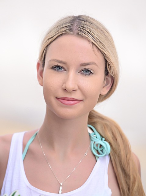 High-waisted tailored navy wide-leg trousers on model with white top