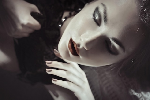 Soft blush pink ruffle-front blouse with v-neckline on female model